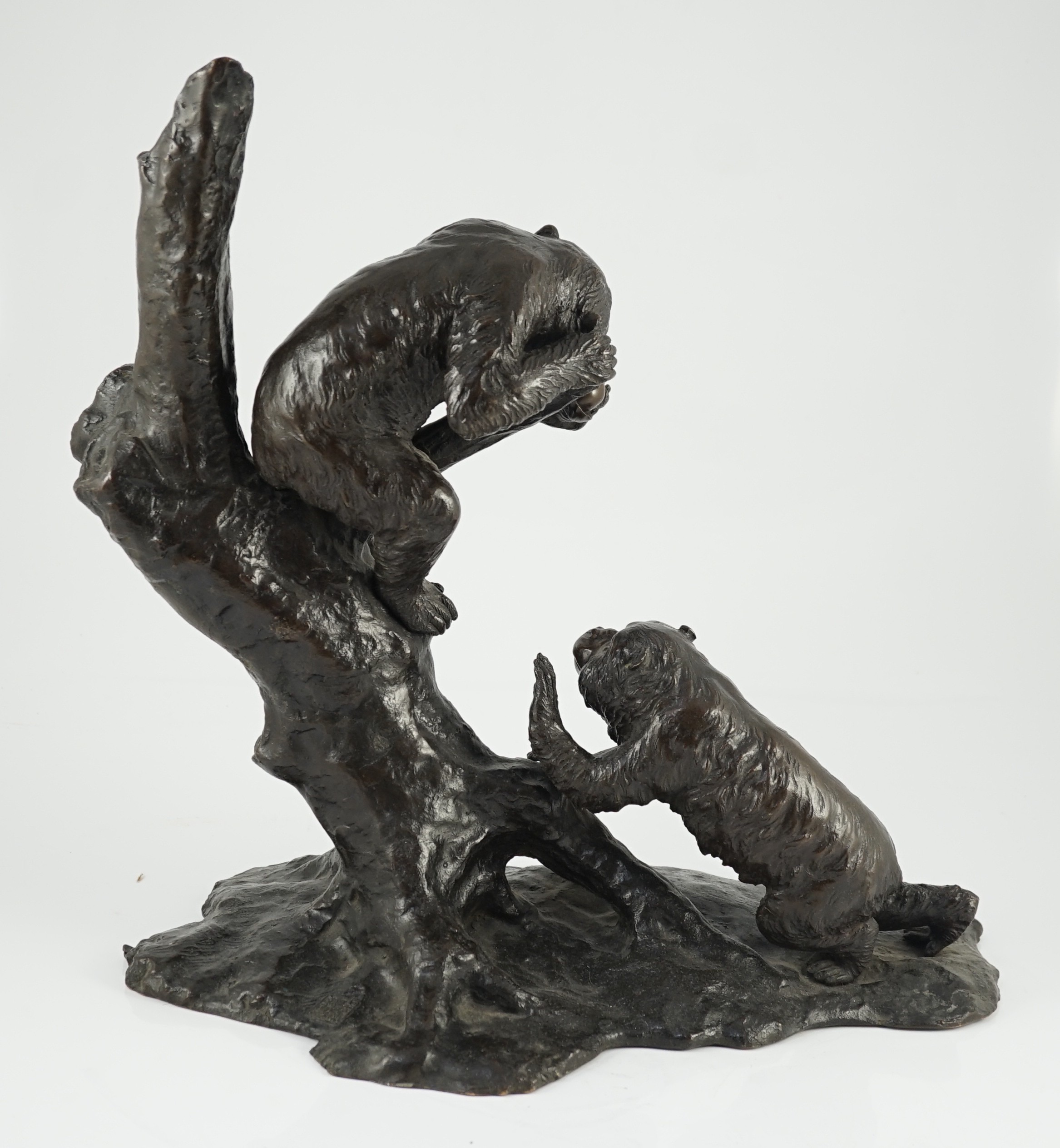 A large Japanese bronze group of two monkeys on a tree, by Genryusai Seiya, Meiji period, 42.5cm high, 43cm wide